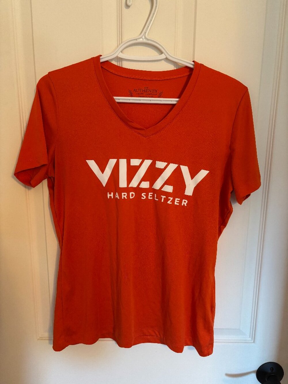 Orange V-neck women's shirt (Vizzy)